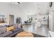 Open-concept living room with vaulted ceiling, seamlessly connecting the kitchen and dining area at 20 Ingate Way, Louisburg, NC 27549