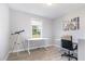 Bright, open office space with sleek white desks, telescope, and inspiring wall art at 20 Ingate Way, Louisburg, NC 27549