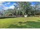 Large backyard with wooden fence and mature trees at 2003 Ryerson Dr, Garner, NC 27529