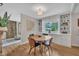 Cozy dining area with hardwood floors, built-in cabinets, and natural light, perfect for enjoying meals with Gathering and friends at 2003 Ryerson Dr, Garner, NC 27529