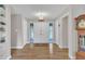 Inviting entryway with hardwood floors, neutral walls, and a classic grandfather clock, radiating warmth and charm at 2003 Ryerson Dr, Garner, NC 27529