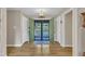 Bright foyer with hardwood flooring, complementing neutral walls, and offering a welcoming view to the outside at 2003 Ryerson Dr, Garner, NC 27529