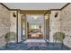 Inviting entryway features brick accents, stylish seating, and a glimpse into the home's bright, open living space at 2003 Ryerson Dr, Garner, NC 27529