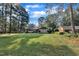 Charming single-story home with mature trees and lush front lawn at 2003 Ryerson Dr, Garner, NC 27529
