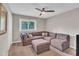 Relaxing living room with comfortable sectional sofa, ceiling fan and natural light at 2003 Ryerson Dr, Garner, NC 27529