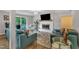 Elegant living room with hardwood floors, a brick fireplace, and access to the outdoors, perfect for relaxing and entertaining at 2003 Ryerson Dr, Garner, NC 27529
