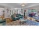 Spacious living room featuring hardwood floors, sliding glass doors to the patio, and stylish decor for modern comfort at 2003 Ryerson Dr, Garner, NC 27529