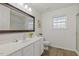 Bright bathroom features a large vanity, a big mirror, and a tiled shower at 2012 Summer Shire Way, Raleigh, NC 27604