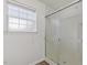 Shower with glass doors and a window, with tile on the walls at 2012 Summer Shire Way, Raleigh, NC 27604
