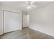 Bedroom features wood floors, ceiling fan, and double closet at 2012 Summer Shire Way, Raleigh, NC 27604