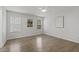 Bright bedroom features wood floors, ceiling fan, and windows with blinds at 2012 Summer Shire Way, Raleigh, NC 27604