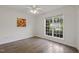 Bedroom features wood floors, ceiling fan, and windows with blinds at 2012 Summer Shire Way, Raleigh, NC 27604