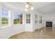 Bright dining nook with large windows, fireplace, and access to the backyard at 2012 Summer Shire Way, Raleigh, NC 27604