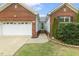 Inviting home featuring an attached garage, and well-manicured landscaping at 2012 Summer Shire Way, Raleigh, NC 27604