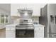 Stylish kitchen with stainless steel appliances, bright lighting, and neutral accents at 2012 Summer Shire Way, Raleigh, NC 27604