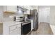 Modern kitchen featuring stainless steel appliances, white countertops, and tiled backsplash at 2012 Summer Shire Way, Raleigh, NC 27604