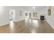 Spacious living room with fireplace, vaulted ceiling, ceiling fan, and wood-look flooring at 2012 Summer Shire Way, Raleigh, NC 27604