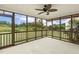 Relax on this screened porch overlooking the backyard and greenery at 2012 Summer Shire Way, Raleigh, NC 27604