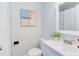 Well-designed bathroom with modern fixtures, a toilet, a sink, and a patterned accent wall at 2014 Athens Ave, Durham, NC 27707