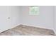 Bright bedroom with hardwood floors, fresh paint, a new window, and closet space at 2014 Athens Ave, Durham, NC 27707