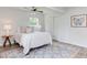 Bright bedroom featuring a queen bed, natural light, and modern accents at 2014 Athens Ave, Durham, NC 27707