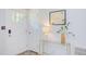 Tastefully decorated foyer featuring a white door, stylish table with a lamp, and modern accents at 2014 Athens Ave, Durham, NC 27707