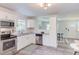 Modern kitchen featuring white cabinets, stainless steel appliances, and granite countertops at 2014 Athens Ave, Durham, NC 27707