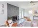 Comfortable living room features a stone fireplace and modern lighting at 2014 Athens Ave, Durham, NC 27707