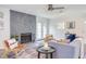 Bright living room with modern furniture and a decorative stone fireplace at 2014 Athens Ave, Durham, NC 27707