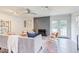 Bright living room featuring a stone fireplace, ceiling fan, stylish furniture, and access to outdoor space at 2014 Athens Ave, Durham, NC 27707