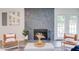 Cozy living room features a stone fireplace and French doors at 2014 Athens Ave, Durham, NC 27707