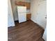Kitchen featuring white refrigerator and light wood cabinets and modern vinyl flooring at 203 Hope St, Erwin, NC 28339
