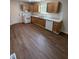 Spacious kitchen with light wood cabinets, white appliances, and vinyl flooring at 203 Hope St, Erwin, NC 28339