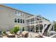 Relax in this backyard featuring a covered deck and cozy patio set at 205 Aurora Rd, Hillsborough, NC 27278