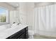 Bathroom with a shower/tub combo and single sink vanity at 205 Aurora Rd, Hillsborough, NC 27278