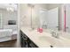 Bathroom featuring double sinks, and a large mirror at 205 Aurora Rd, Hillsborough, NC 27278