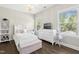 Bright bedroom with a ceiling fan, natural light and a TV at 205 Aurora Rd, Hillsborough, NC 27278