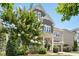 Charming two-story home showcasing a well-maintained front yard, a blend of brick and siding, and a beautiful tree at 205 Aurora Rd, Hillsborough, NC 27278