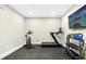 Home gym featuring a treadmill, exercise bike and free weights at 205 Aurora Rd, Hillsborough, NC 27278