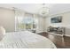 Main bedroom with a large window, ample light, and decorative light fixture at 205 Aurora Rd, Hillsborough, NC 27278