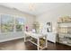 Bright home office with a chandelier, natural light and hardwood floors at 205 Aurora Rd, Hillsborough, NC 27278
