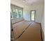 Bright bedroom featuring large windows and access to a private outdoor area at 213 Maye St, Dunn, NC 28334
