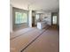 Open-concept kitchen with white cabinets, a large island, and ample countertop space at 213 Maye St, Dunn, NC 28334