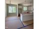 Stylish kitchen featuring white cabinetry, a functional island, and plenty of natural light at 213 Maye St, Dunn, NC 28334