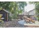 Backyard features a wooden shed, picnic table, and landscaping at 216 Northwood Cir, Durham, NC 27701