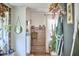 Hallway with hardwood floors, custom storage, and decorative elements, leading to the kitchen at 216 Northwood Cir, Durham, NC 27701