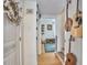Hallway with wooden floors and decorated with musical instruments and a wreath at 216 Northwood Cir, Durham, NC 27701