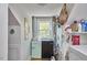 Cozy laundry room with stacked washer and dryer and mini fridge for added convenience at 216 Northwood Cir, Durham, NC 27701