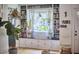 Bright living room with built-in bookshelves surrounding a window and hardwood floors at 216 Northwood Cir, Durham, NC 27701
