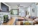 Cozy living room featuring a fireplace, built-in shelves, and hardwood floors at 216 Northwood Cir, Durham, NC 27701